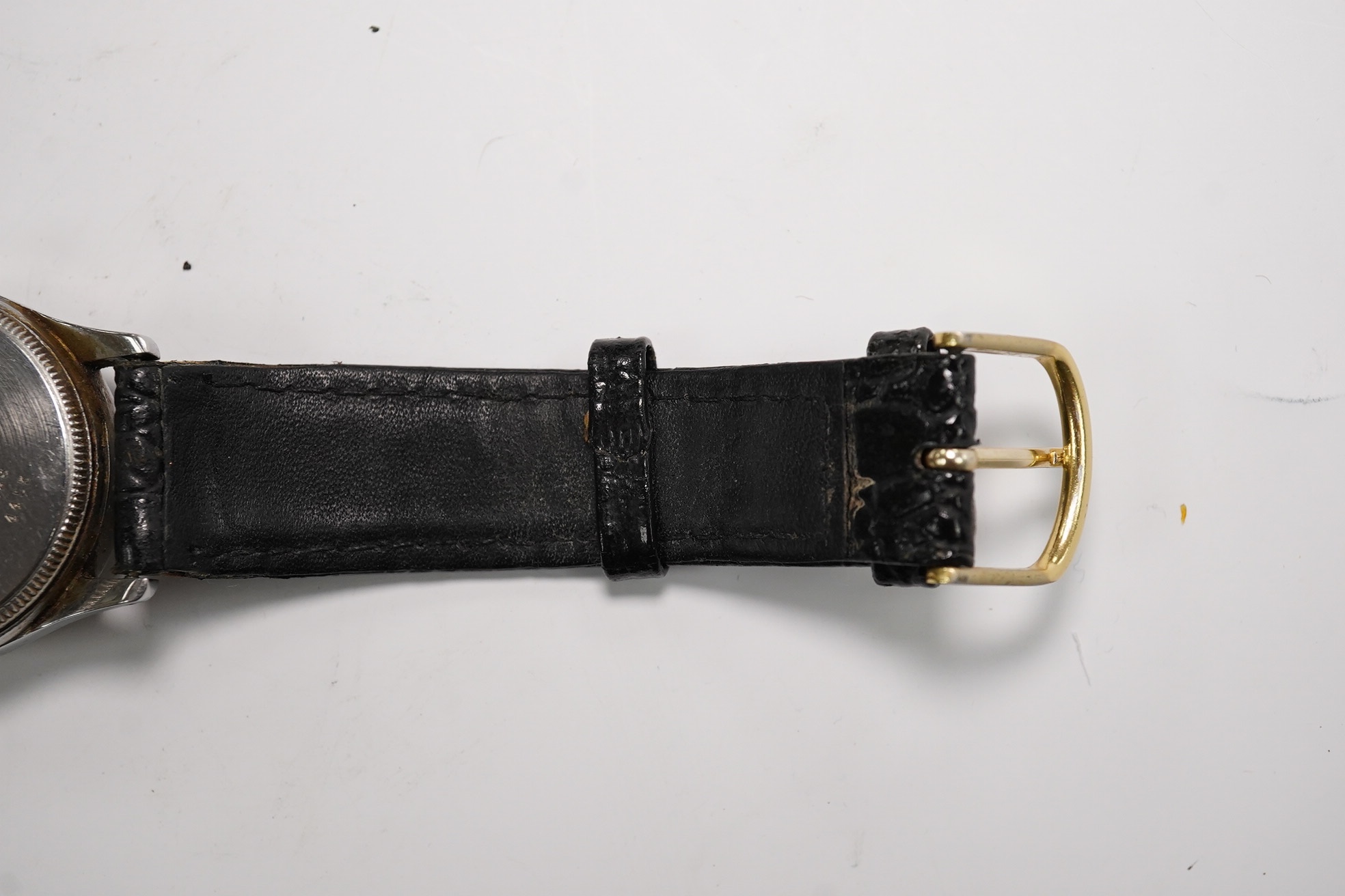 A stainless steel Tudor Oyster manual wind wrist watch, on an associated strap, case diameter 31mm. Condition - poor to fair